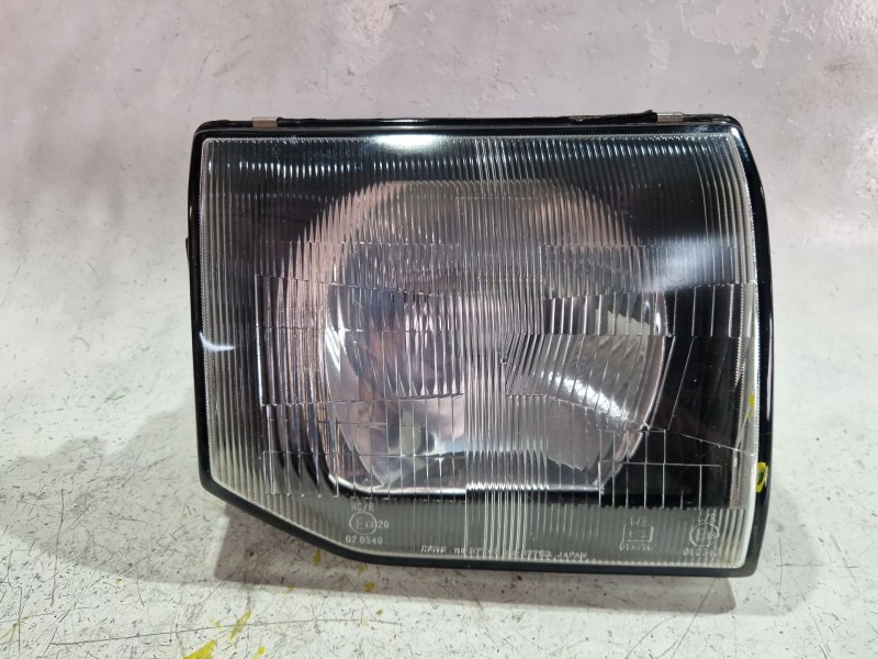 Recambio de faro delantero derecho para mitsubishi pajero 2.8 d 125cv referencia OEM IAM E1320  